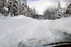 A secondary road in Dover, Vt., narrowed to a single car width by snow. Roger Leo Photo.