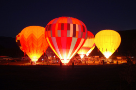 Balloons light up at night during the Snowmass Balloon Festival. 
