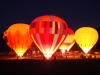 Balloons light up at night during the Snowmass Balloon Festival. 