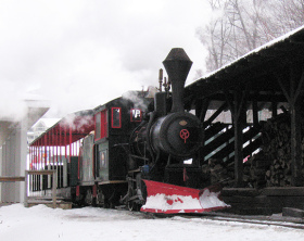 The JE Henry steam locomotive carries passengers across Loon's base area, from one lodge to another, summer and winter.