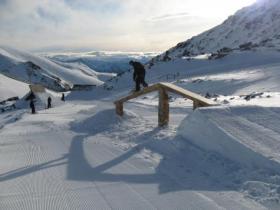 Terrain park crew member Tim Cunliffe checking a Stash feature, from Alexa Forbes, Remarkables