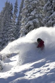 A telemark skier in deep powder at Wolf Creek, Colo.