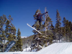 Snowboarder catches air at Winter Park's Railyard.