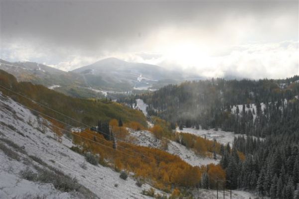 Clouds loom over the Wasatch Mountains. Area resorts could receive a foot or more of snow by the end of the weekend.