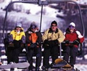 Clubs run outings to areas like Camelback, where these skiers are riding the quad.