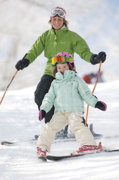 Mother and daughter ski at Mount Sunapee.