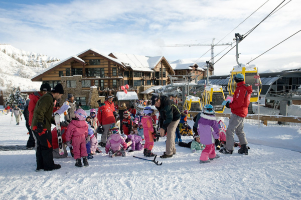 Kids prepare for their skiing and snowboarding lessons in Snowmass, Colo.