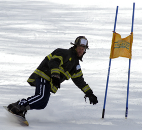 Firefighter in gear competes in last year's muster at Wachusett.