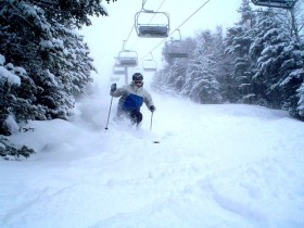 A skier bounces through powder bumps at WIldcat, N.H.