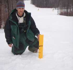 Rich Knoll, snowmaker at Hidden Valley, PA, measures snow depth in excess of 10 feet on the top of Comet slope.     