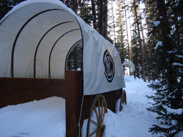 Kids can ski through Conestoga Wagons on the Wild West Trail at Beaver Creek. Photo Courtesy Greg Willis.