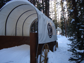 Kids can ski through Conestoga Wagons on the Wild West Trail at Beaver Creek. Photo Courtesy Greg Willis.