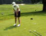 A golfer on the practice putting green at Stratton Golf U.