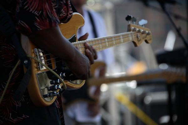 A guitarist strumming at Winter Park's Blues Fest