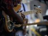 A guitarist strumming at Winter Park's Blues Fest
