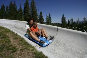 Riders on Winter Park's alpine slide.