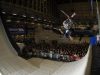 A skier flying high over the crowd at the British Snow Tour.
