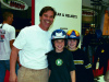 A happy father and his sons with new helmets at the Chicago Ski Show & Snowboard Expo.