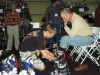 A visitor getting fitted for new boots at the Colorado Ski & Snowboard Expo.