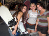 A trio of female visitors browsing snowboards at SnowJam Las Vegas.
