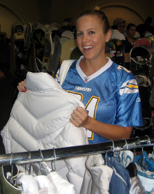 A visitor shopping for new ski apparel at SnowJam San Diego.