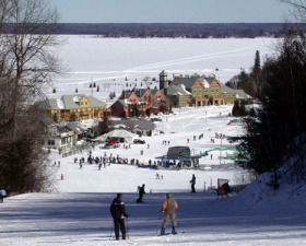 Skiers and riders gliding down to Dickson Manor at Ontario's Calabogie.
