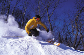 Skier cruises Camelback terrain.