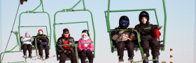 Chairlift wisks skiers uphill at Big Bear, PA.