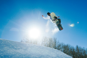 A boarder catches big air at Snowmass.