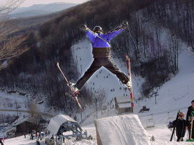 Leaping off a jump at Plattekill Mountain. Right.