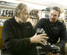 Leif Mikkelsen, left, of Strand's Ski Shop in Worcester, Mass., talks with Brent Booher of Lafayette, N.Y., about ski boots.