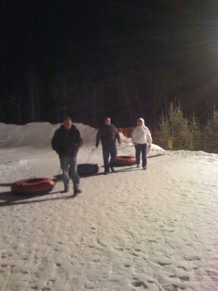 The boys having fun on the tubing hill