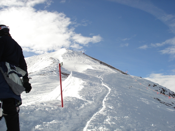hiking upward/ along highland bowl