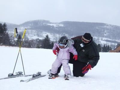 Father And Daughter Skiing Wisp