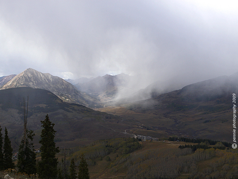 Snow Squall in the East River Valley : : : : : : : :
Friday’s second and third shots offer a pretty good feel for what the afternoons have been like the past few days in Crested Butte. This shot was taken from the upper mountain, looking up the East River Valley. Snow showers were doing a chilly, lazy sashay across the beautiful valley Thursday afternoon. The hillsides are definitely starting to take on the grayish/brown appearance of late fall out there.
: : : : : : : : And one more . . .
