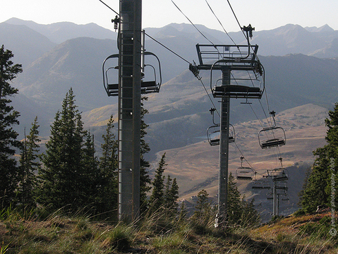 High Winds Rake the Mountains and Valleys     : : : : : : : :   
Wednesday’s conditions were constantly changing around Crested Butte.  We started off the day with a rain that felt like it would hang in there all day.  But the clouds had broken up by noon and the winds kicked in.  And man, did it blow out there!  The top of Gold Link was showing gusts in the mid fifties and trees were crashing down on the mountain.  Today’s second shot shows the chairs near the top of the Silver Queen Lift getting buffeted in the wind blasts.  With the raucous winds raging through the trees and carrying an afternoon round of snow and rain, being out on the mountain wasn’t for the faint of heart.
     : : : : : : : :   While the skies cleared off completely and the winds backed off somewhat in the early evening, temps dropped quickly as the sunset.  The forecast still shows a fifty-percent chance of snow through Thursday, with a high that won’t break forty degrees.   
     : : : : : : : :   Have a good day out there and we’ll see you tomorrow to put this week in the books.  

