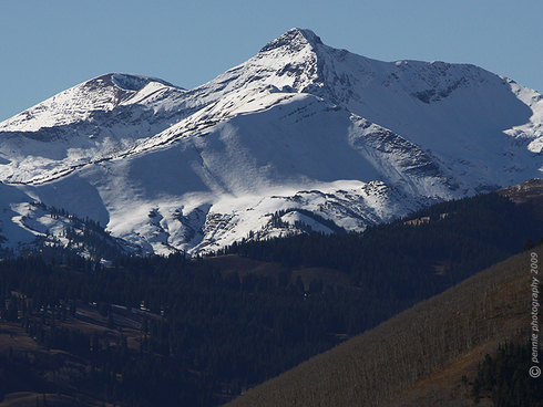 High Country Whiteness in Paradise
Wednesday’s shot is of the whiteness that our early-week weather brought to the Paradise Divide area.  This is Treasury Peak with several inches of new snow and looking pretty rugged in the afternoon light.  There's probably not enough snow to make turns on in the high country, but a few more storm cycles like this and the local backcountry powder hounds will be getting the itch to head out and see how it skis.  
Tuesday was a bluebird day in Crested Butte.  Temps hovered in the high thirties and low forties for much of the day.  While working on the upper mountain, I noticed that it definitely wasn’t fall anymore.  There was an inch or two of new snow crunching under foot and the air carried that hard to articulate, but nonetheless certain aroma of cold.  It seems a little early for snow and cold, but our summer was apparently destined to be short on both ends.  I wonder if winter isn’t planning on coming early, going huge and staying long?  If it's going to be winter it might as well be WINTER!  
Looks like Wednesday is going to be mostly sunny before we see another shot of moisture move in for Thursday.  Enjoy your day and (barring further technical difficulties) we’ll do it again tomorrow. 