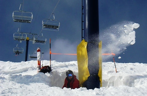 The picture above clearly exhibits the phenomenal conditions at Moonlight Basin. One of our helpful Professional Ski Patrollers, Brain, digs in to the deep snow around a lift tower for some spring maintenance. Photo by Benjamin Daniel, Mountain Reporter